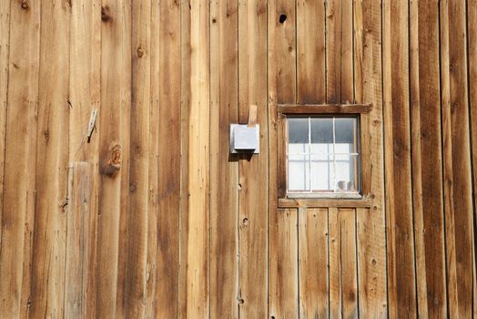 a wooden wall in Bodie historic state park of a ghost town from a gold rush era in Sierra Nevada