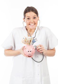 happy woman doctor with piggy bank full of money