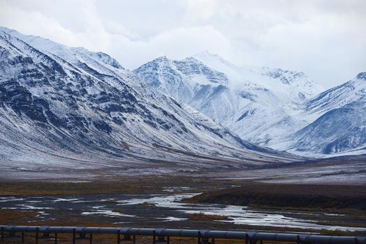 oil pipeline with mountain in northern alaska