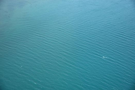 aerial view of blue lake in alaska