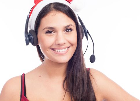 Christmas headset woman from telemarketing call center wearing red santa hat talking smiling isolated on white background.