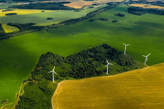 Windmills on the background of forests and fields. Windmill in nature.Belarus.