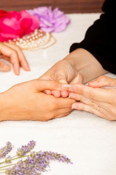 Manicure of nails from a woman's hands before applying nail polish