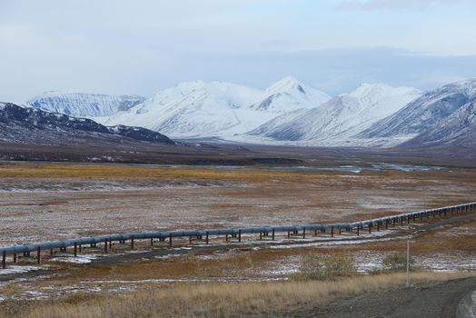 oil pipeline with mountain in northern alaska