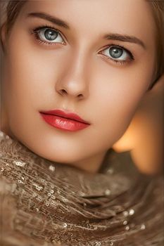 Beauty, luxury fashion and glamour, beautiful woman dressed in gold, portrait