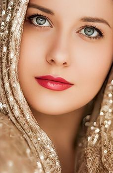 Beauty, luxury fashion and glamour, woman dressed in gold, portrait