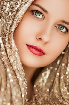 Beauty, luxury fashion and glamour, woman dressed in gold, portrait