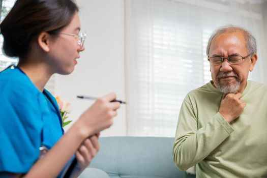 Doctor woman examines lymph nodes on elderly neck to determine if swollen, sore throat, Asian young nurse checking senior old man neck pain in clinic at retirement home, physical therapist