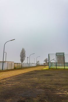 Gloomy cold winter landscape with frost and fog in Center of Bremerhaven Bremen Germany.