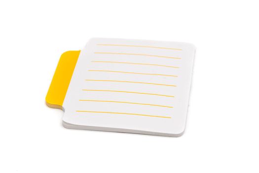 Blank small lined sticky notes with yellow tab on the left side of paper sheet, isolated on white background, closeup view