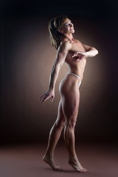 strong woman body builder walk side show naked spine