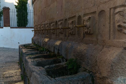 side view of the fountain of the eight spouts in ronda, malaga
