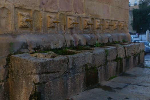 side view of the fountain of the eight spouts in ronda, malaga