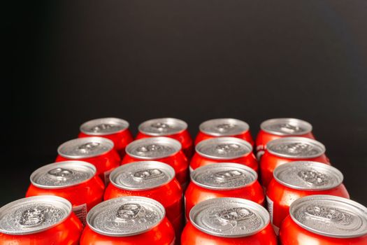 group of beer cans isolated on a black background