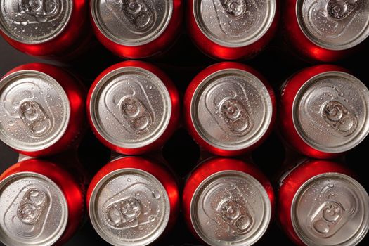 group of beer cans isolated on a black background