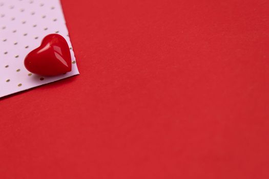 Valentines day red heart on same color background. Monochromatic vivid color. Valentine's day concept. Close up, copy space