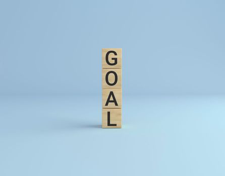 Goal word made with wooden cube blocks tower. business concept.