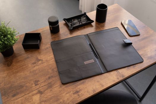 open leather folder for documents on the desktop.