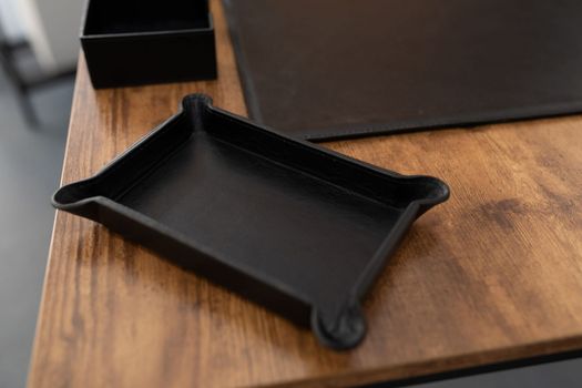 accessories for stationery made of leather on the desktop.