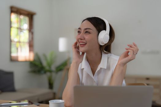 Young Woman Listening To Music Online Wearing Wireless Earphones, Enjoying Favorite Song. Playlist, Music Application.