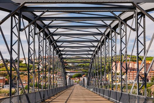 The steel bridge over the Douro River in Peso da Regua is for pedestrians only and offers beautiful views, Portugal