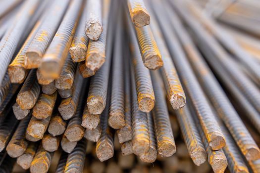 A large bundle of iron construction fittings in close-up. A bunch of new construction iron fittings on the construction site. High quality photo