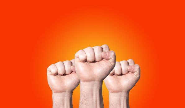 Fists raised up banner about unity isolated on orange, solidarity of people