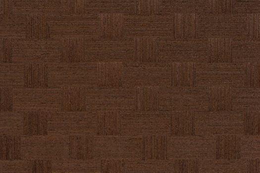 Texture of wenge wood. Dark brown wood for furniture or flooring. Close-up of a Wenge wooden plank, top view. Wenge is pasted over with squares for making furniture