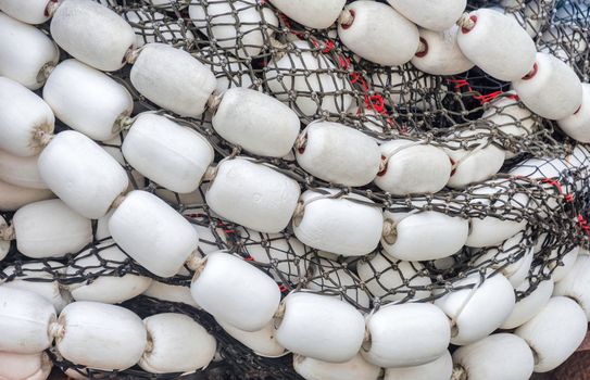 Trawler fishing net and floats stored on air.