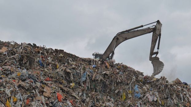 Work of a bulldozer at a landfill