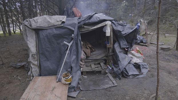Homemade homeless dwelling next to a landfill