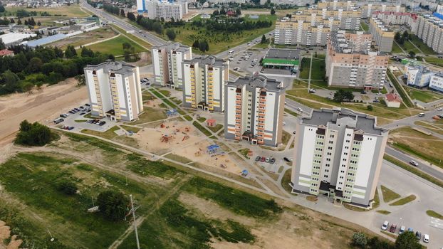 A new recently built neighborhood of apartment buildings. Drone video