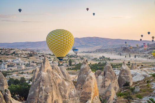 Colorful hot air balloon flying over Cappadocia, Turkey.