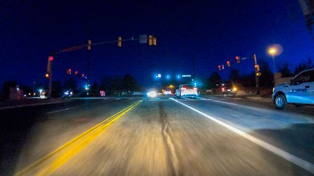 Denver, Colorado, USA-January 17, 2020 - Driving on typical paved roads at night in suburban America.