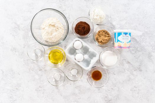Denver, Colorado, USA-January 29, 2021 - Flat lay. Ingredients to prepare unicorn rainbow chocolate cupcakes on the counter.
