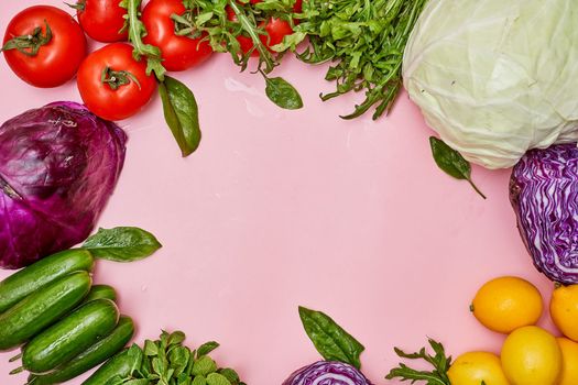 vegetables and fruits on a pink background with copy - space in the top right hand corner to the middle left