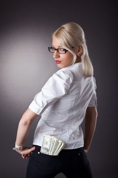 sexy business woman give a dollars with scorn isolated