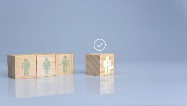 Concept of Business and HR for leadership and team leader. One cube wood block out in front  Different and stand out from the group