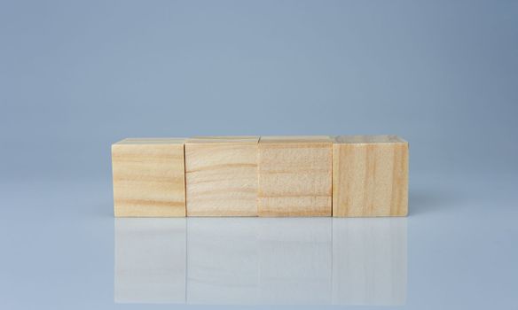 empty wooden blocks lined up on a white background. Business concept.