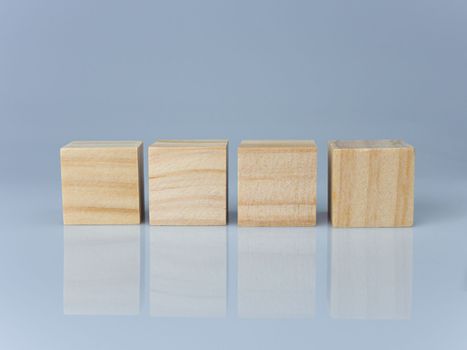 empty wooden blocks lined up on a white background. Business concept.