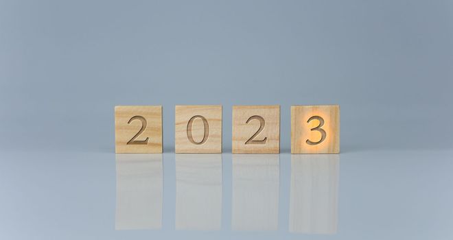 Wooden blocks lined up with the letters 2023. Represents the goal setting for 2023, the concept of a start. financial planning development strategy business goal setting