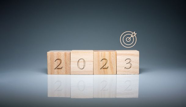 Wooden blocks lined up with the letters 2023. Represents the goal setting for 2023, the concept of a start. financial planning development strategy business goal setting
