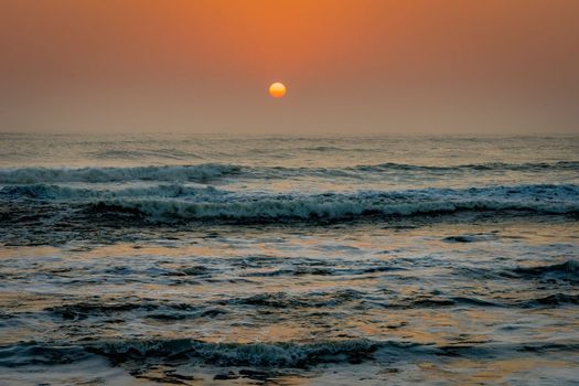 Atlantic Ocean waves at sunset at Terrace Bay in the Skeleton Coast National Park in Namibia in Africa.