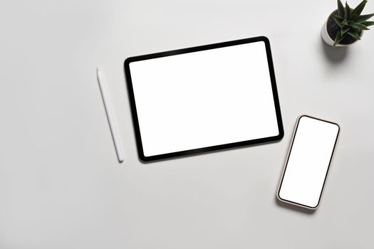 Mock up digital tablet and smart phone with blank screen on white background.