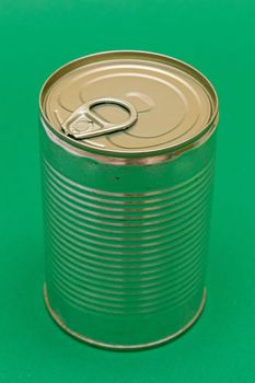 Unopened Tin Can with Blank Edge on Green Background. Canned Food. Aluminum Can for Safe and Long Term Storage of Food. Steel Sealed Food Storage Container