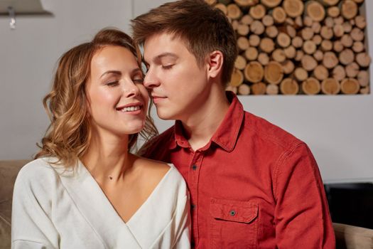 Close up portrait of a beautiful couple looking to each other. They are in love and happy