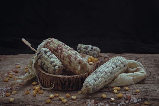 Fresh waxy corn or Sweet glutinous corn and Corn kernelson Rustic old wooden background. Tropical whole grain food, Selective focus.