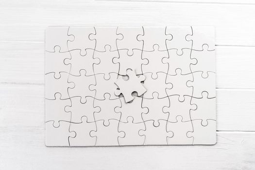 Top view of white jigsaw puzzle