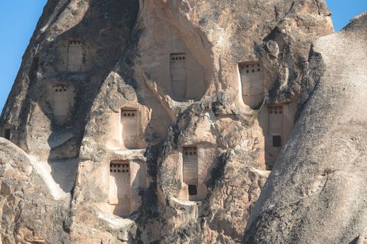 Cave dwellings in stony mountains of Cappadocia, Turkey