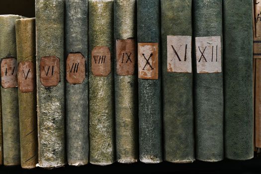 Old books with Roman numerals in the library archive